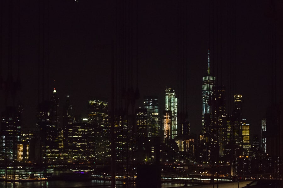 views of Manhattan at night from the Manhattan Bridge