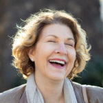 Sharon Eucce laughing during her personal branding shoot in San Diego