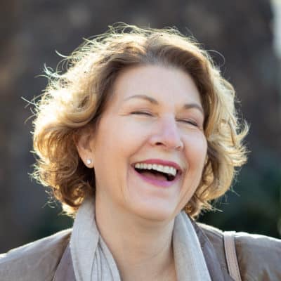 Sharon Eucce laughing during her personal branding shoot in San Diego